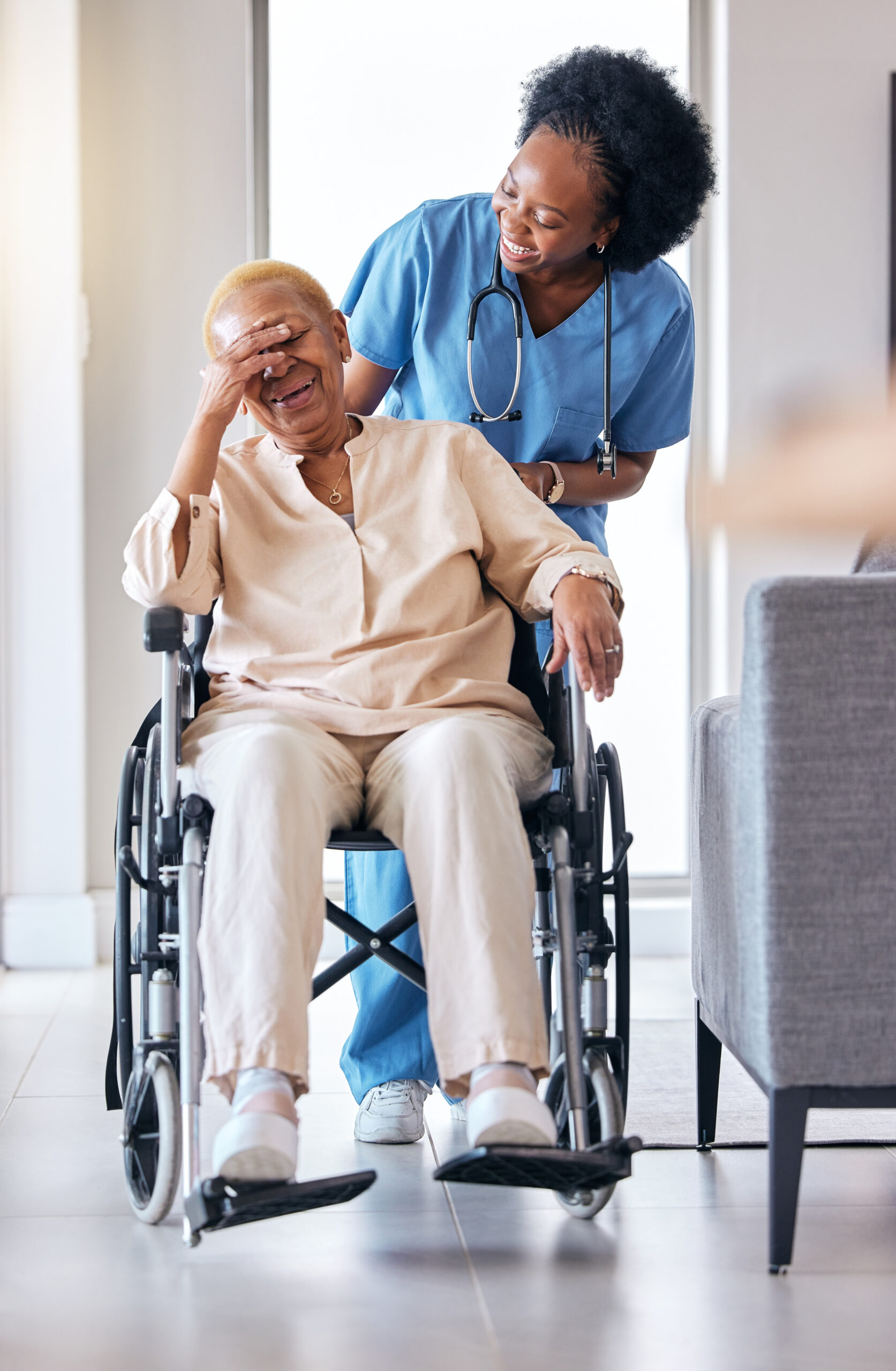 nurse senior woman laugh with wheelchair